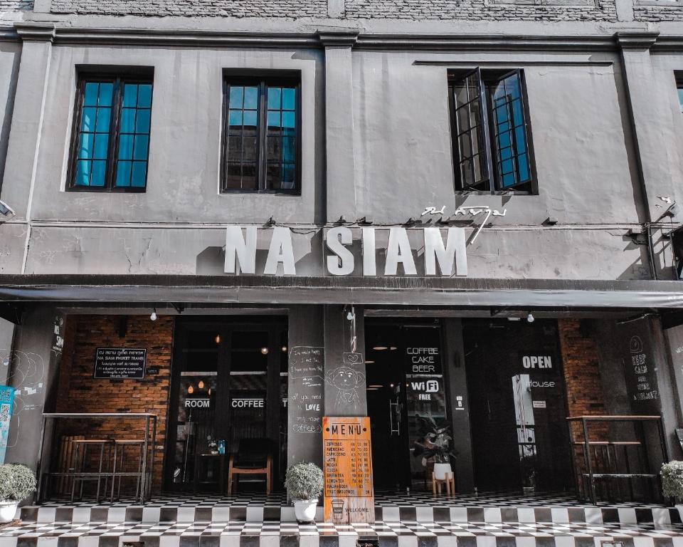 a building with a sign that reads n a stawn at Na Siam Guesthouse in Phuket Town