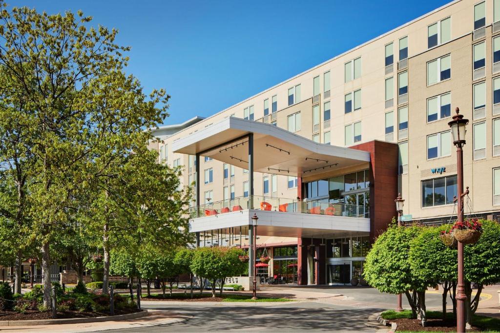 a large building with a balcony in front of it at Aloft Leawood-Overland Park in Overland Park