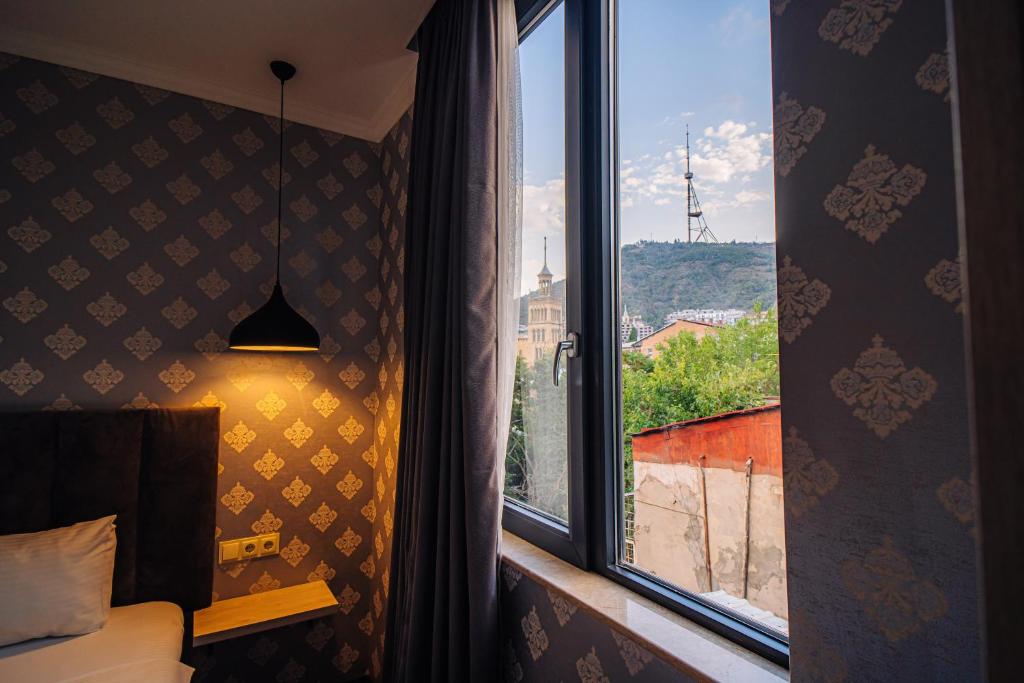 Postel nebo postele na pokoji v ubytování Hotel Day Inn
