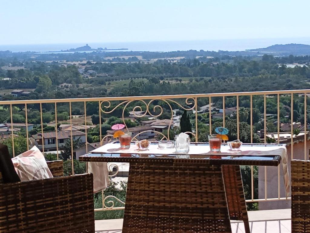a table on a balcony with a view at La pecorella in vacanza IUN R3384 in Pula