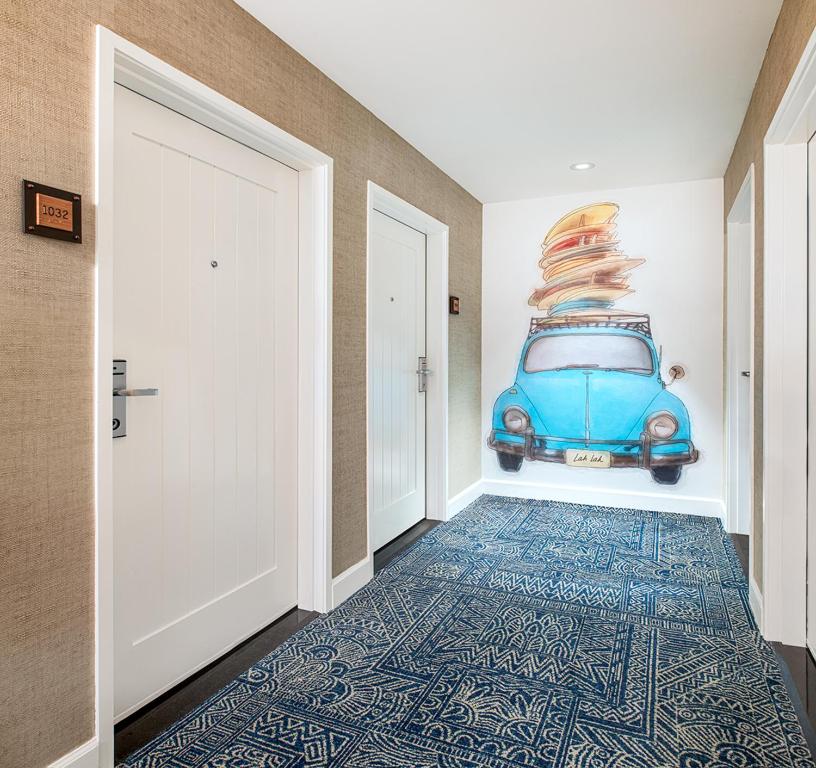 an empty hallway with an old blue car on the wall at Margaritaville Hotel San Diego Gaslamp Quarter in San Diego