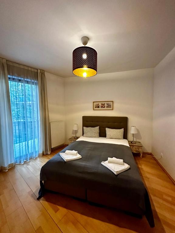 Posteľ alebo postele v izbe v ubytovaní Leda Apartments