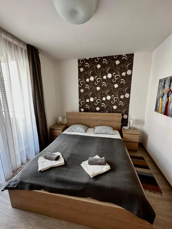 Posteľ alebo postele v izbe v ubytovaní Leda Apartments