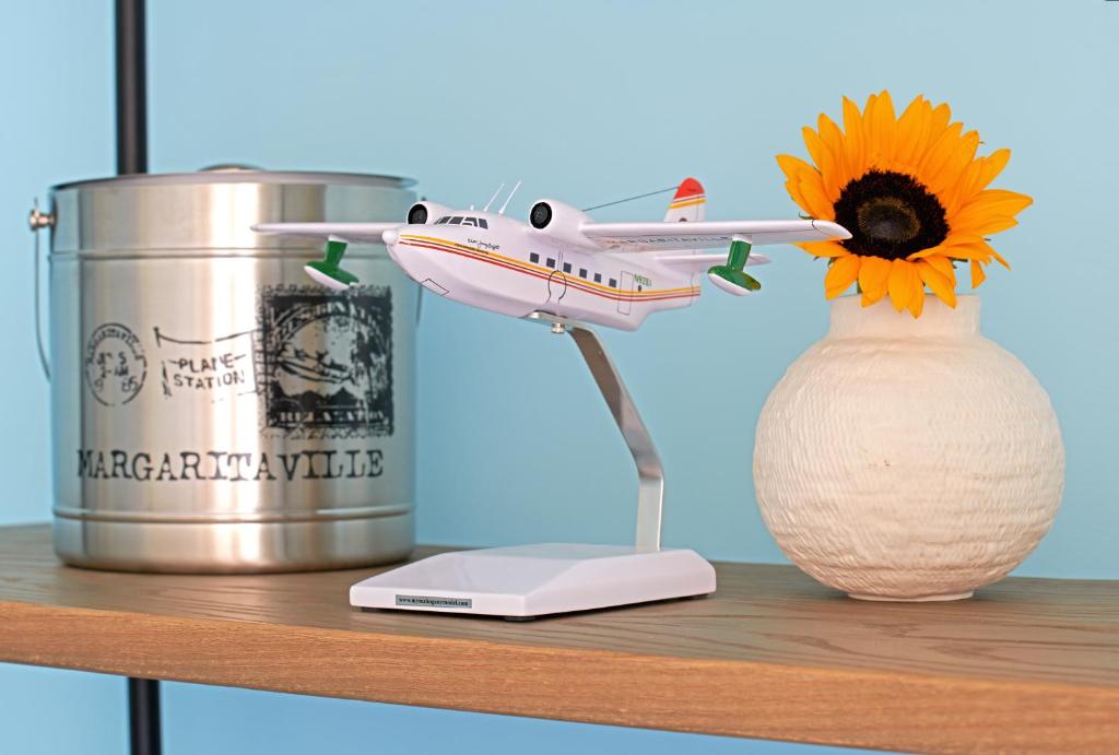 a toy airplane sitting on a shelf next to a can at Margaritaville Hotel San Diego Gaslamp Quarter in San Diego
