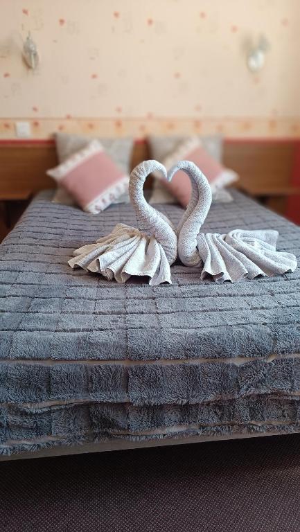 Postel nebo postele na pokoji v ubytování Hôtel Le Pommeil