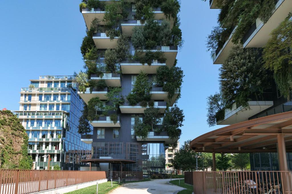 a building with plants on the side of it at Luxury Suite in Bosco Verticale Milano Isola in Milan