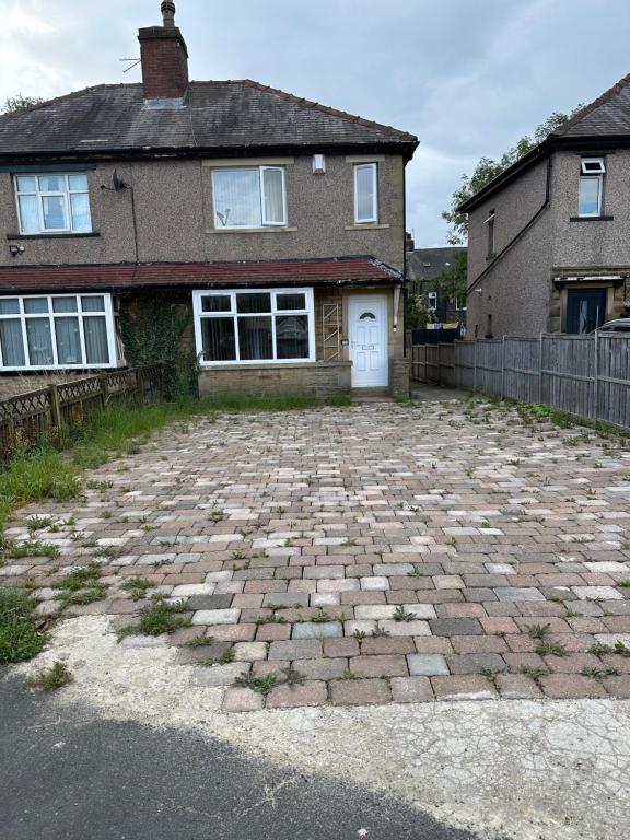 a brick driveway in front of a house at Cheerful 3 bed semi-detached property in Bradford
