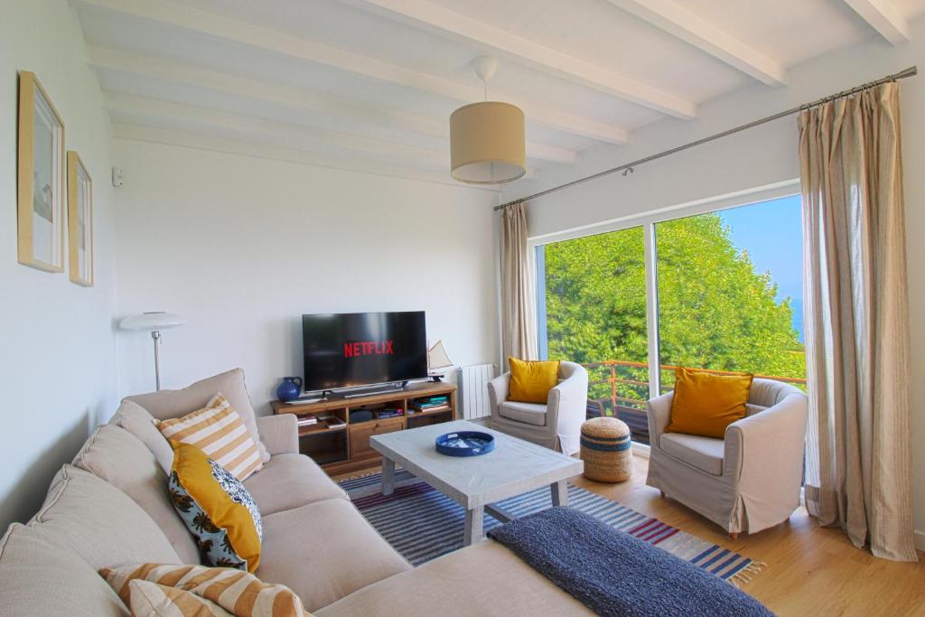TV a/nebo společenská místnost v ubytování Marina House