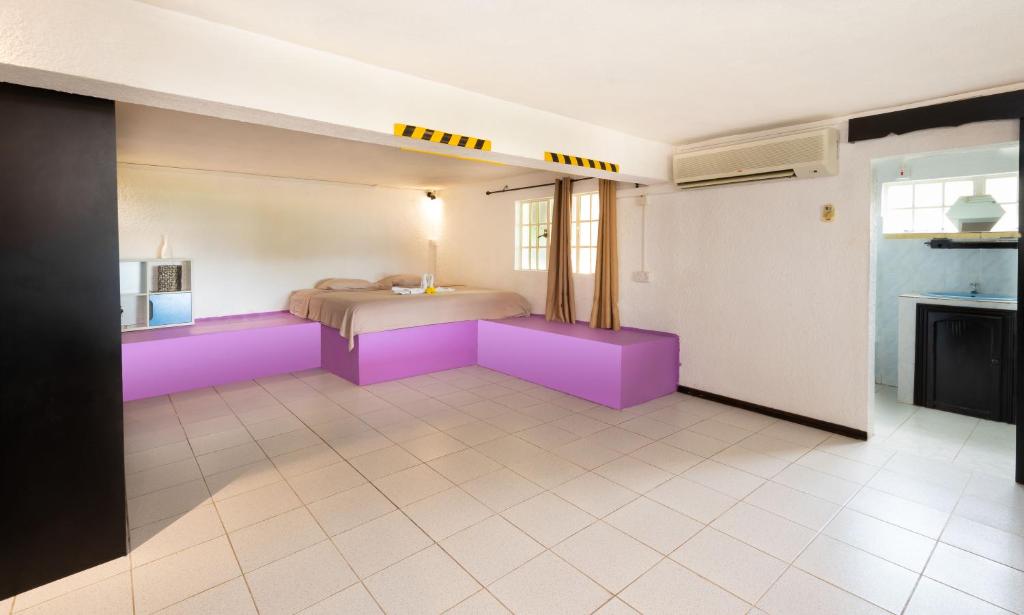 Postel nebo postele na pokoji v ubytování Twakila Sunset Suites