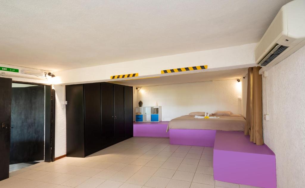 Postel nebo postele na pokoji v ubytování Twakila Sunset Suites