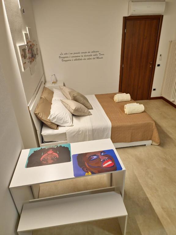 Postel nebo postele na pokoji v ubytování GESUITIROOMS