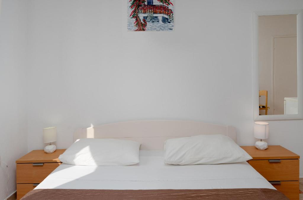 Postel nebo postele na pokoji v ubytování Apartments Family Gligora