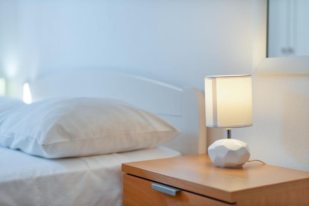 Postel nebo postele na pokoji v ubytování Apartments Family Gligora