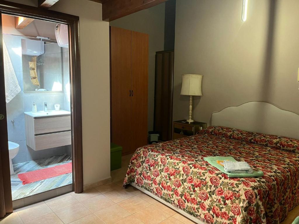Postel nebo postele na pokoji v ubytování CD Romanello (Mura S. Cataldo)