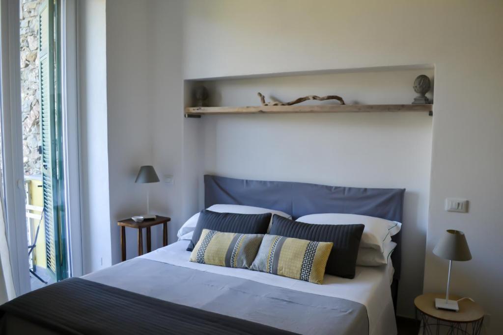 Postel nebo postele na pokoji v ubytování Il Carugio di Corniglia