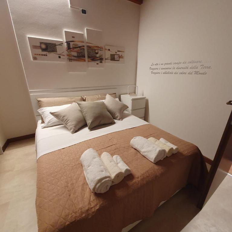 Postel nebo postele na pokoji v ubytování GESUITIROOMS