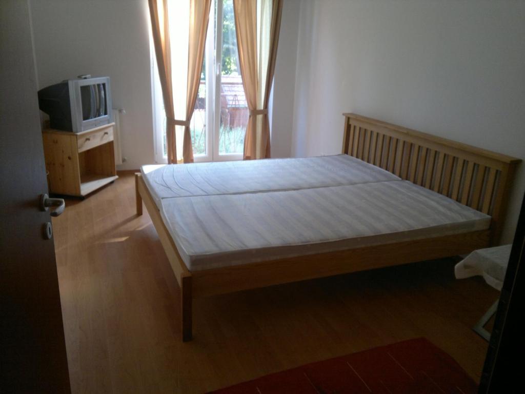 Posteľ alebo postele v izbe v ubytovaní Villa Palazzo Apartments