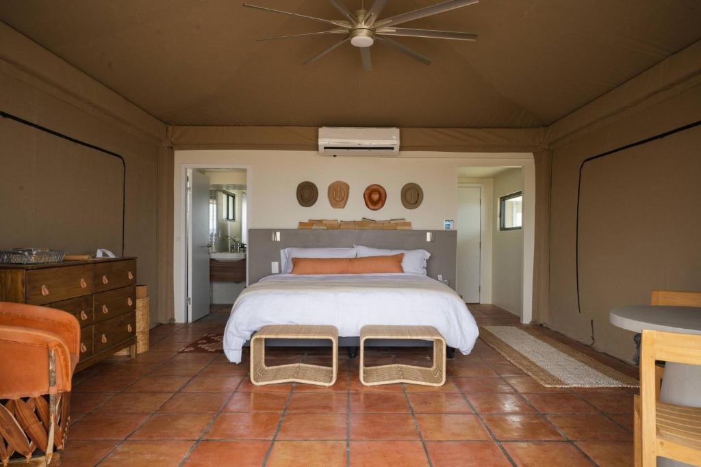 a bedroom with a large bed and a ceiling at Camp Elena - Luxury Tents Minutes from Big Bend and Restaurants in Terlingua