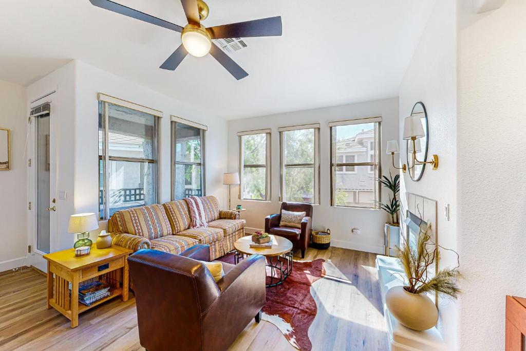 a living room with a couch and a ceiling fan at Kierland Greens #2122 in Scottsdale