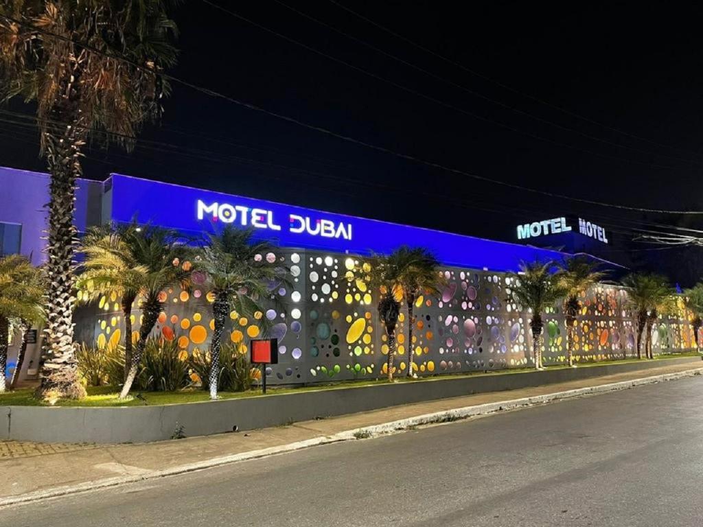 a motel dublin sign on the side of a building at Motel DUBAI BH in Belo Horizonte