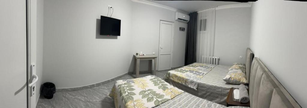 Postel nebo postele na pokoji v ubytování Hotel Amigo