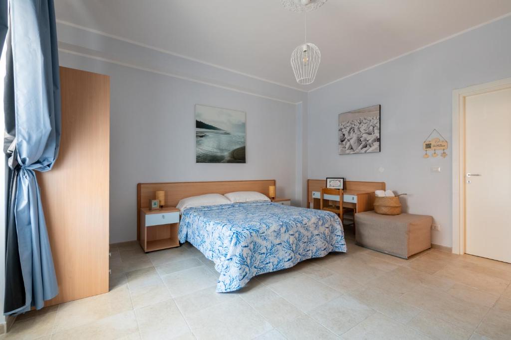 Postel nebo postele na pokoji v ubytování Riva Vieste Suites