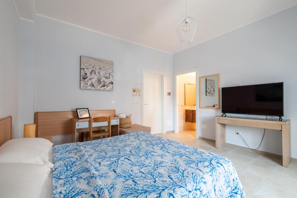 TV a/nebo společenská místnost v ubytování Riva Vieste Suites