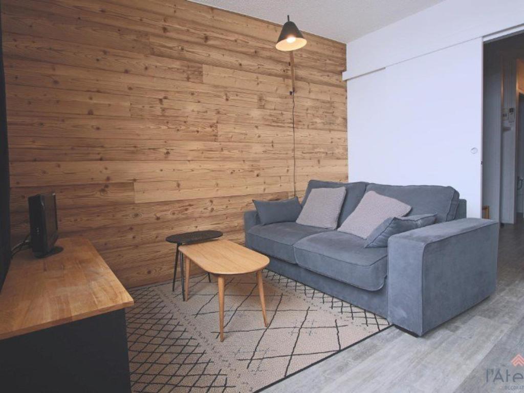 a living room with a couch and a table at Studio Piau-Engaly, 1 pièce, 5 personnes - FR-1-457-175 in Aragnouet