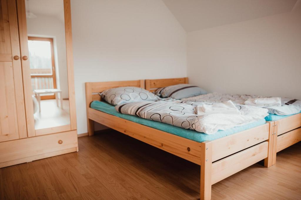 Postel nebo postele na pokoji v ubytování Penzion Na Boučí