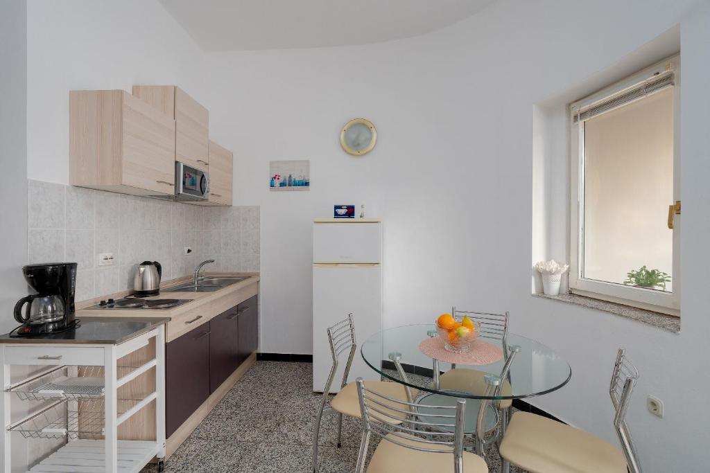 Kuchyň nebo kuchyňský kout v ubytování Apartments Family Gligora