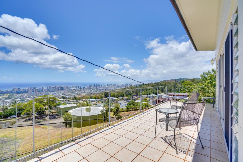 a balcony with a view of the city at Honolulu Hideaway with Balcony City and Ocean View! in Honolulu
