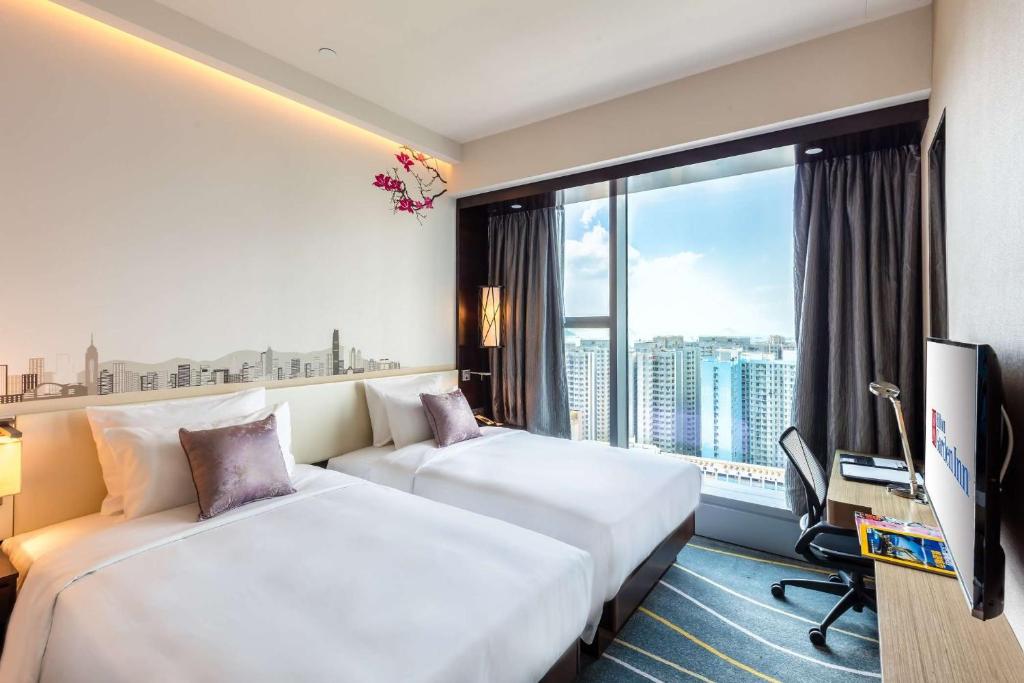 Letto o letti in una camera di Hilton Garden Inn Hong Kong Mongkok