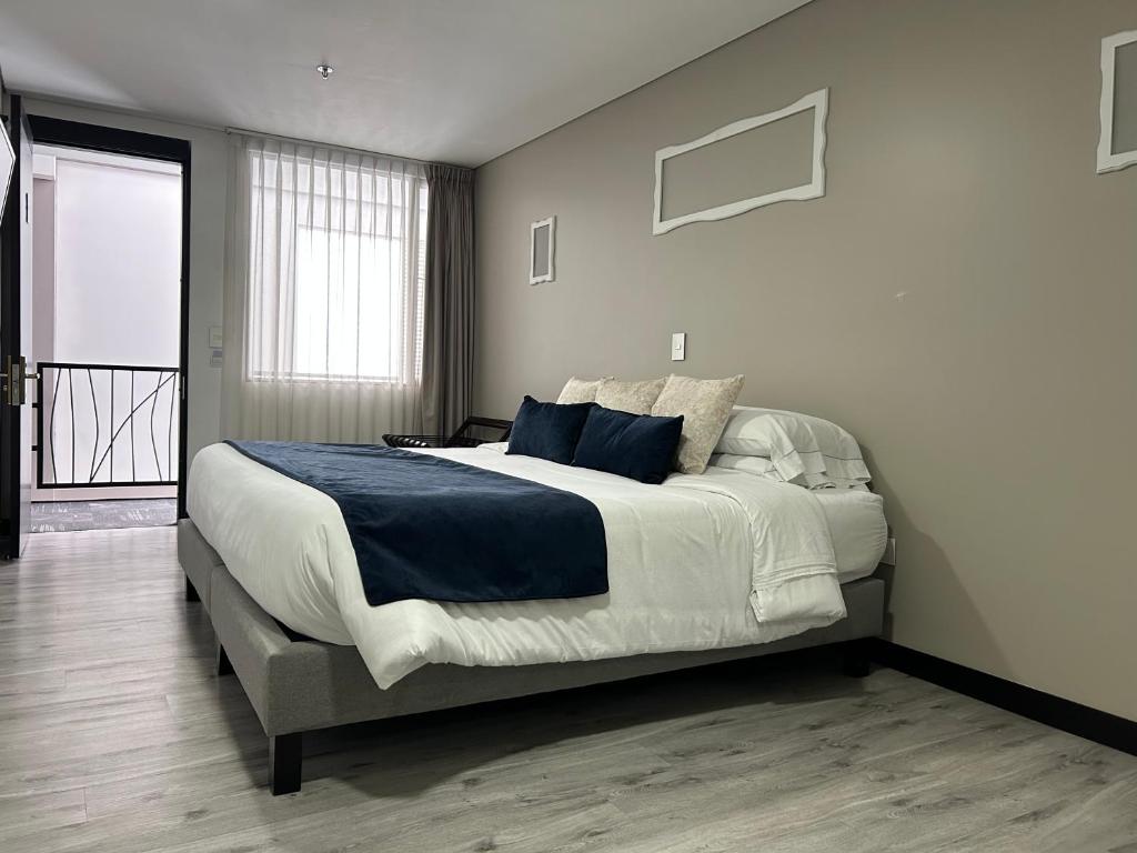 Postel nebo postele na pokoji v ubytování Hotel WLH Silver Corferias
