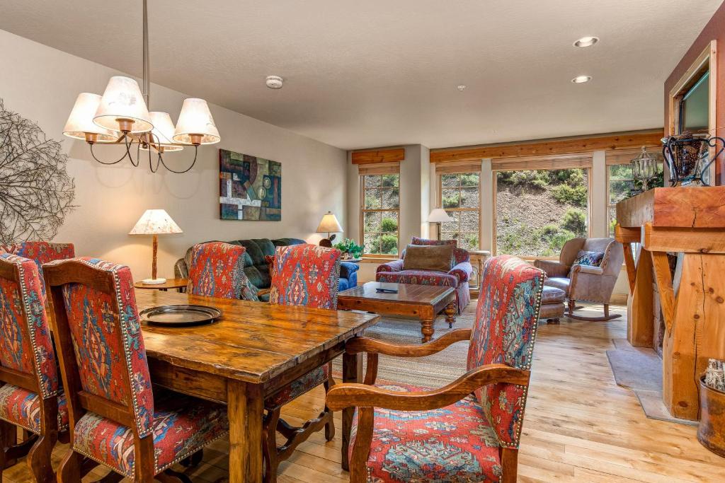 a living room with a wooden table and chairs at Lodges at Deer Valley 2218 and 2220 in Park City