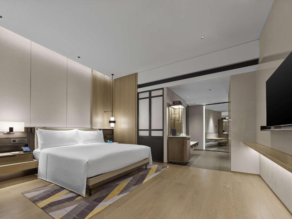 Postel nebo postele na pokoji v ubytování Hilton Zhuhai