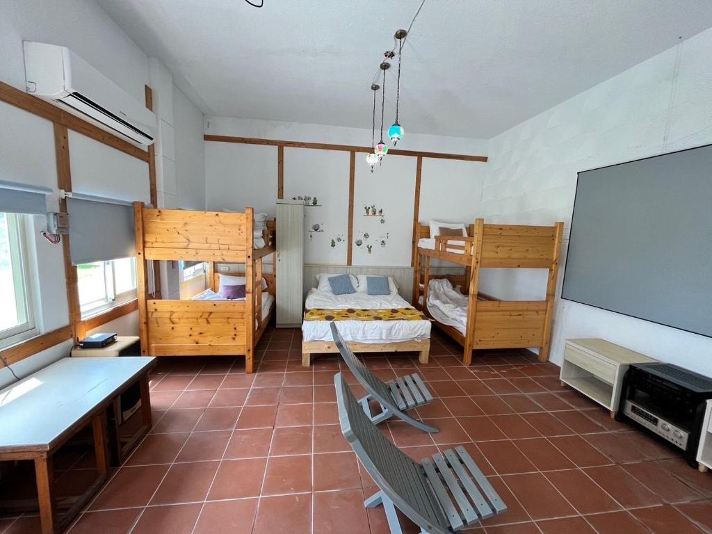 Postel nebo postele na pokoji v ubytování 太平洋渡假村