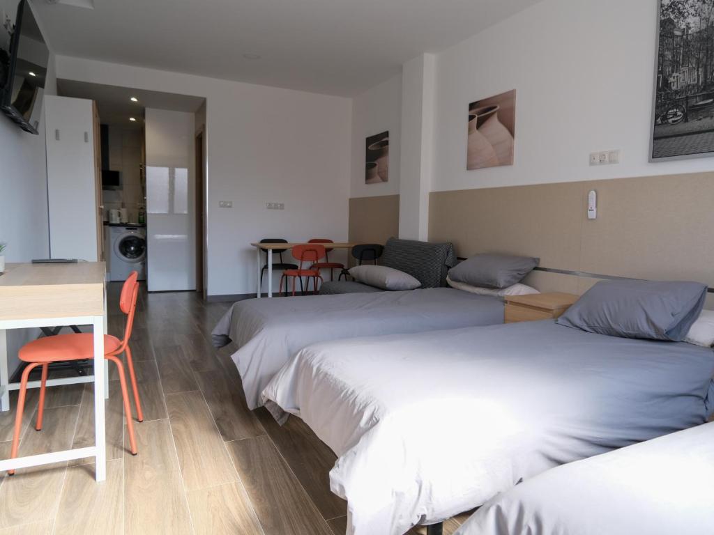 Postel nebo postele na pokoji v ubytování Alianza Suites