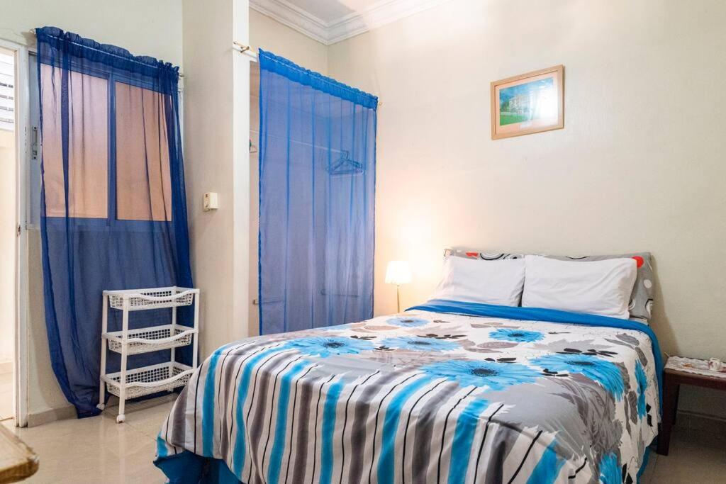 Postel nebo postele na pokoji v ubytování Cerca del Mar, Obelisco Hembra y Zona Colonial