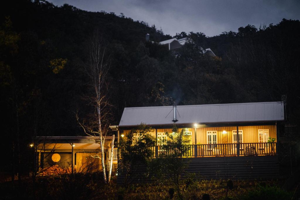 a house lit up at night with lights at Eliza's in Bright