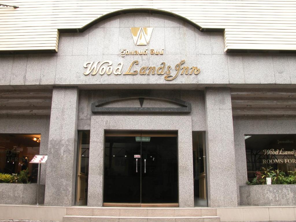 a wild ends fire sign on the front of a building at Woodlands Inn in Bangkok