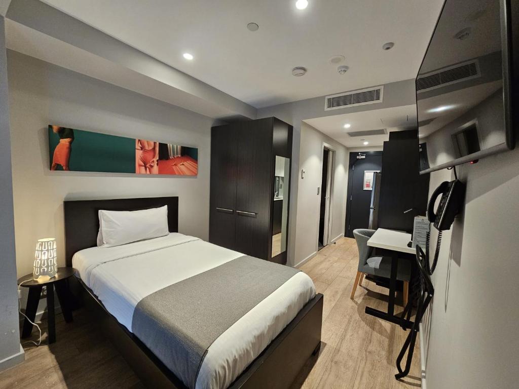 TV a/nebo společenská místnost v ubytování Studio 8 Residences - Adults Only