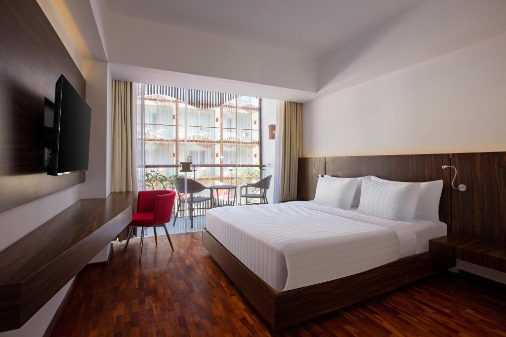 Postel nebo postele na pokoji v ubytování The Bene Hotel