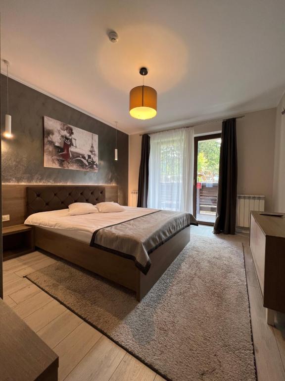 Postel nebo postele na pokoji v ubytování Garden Apart Predeal