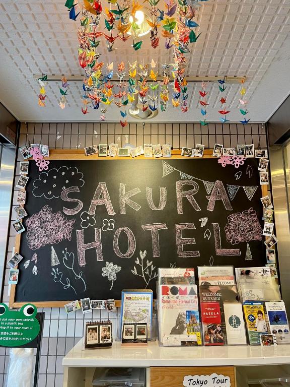a chalk board with a sign for a restaurant at Sakura Hotel Ikebukuro in Tokyo
