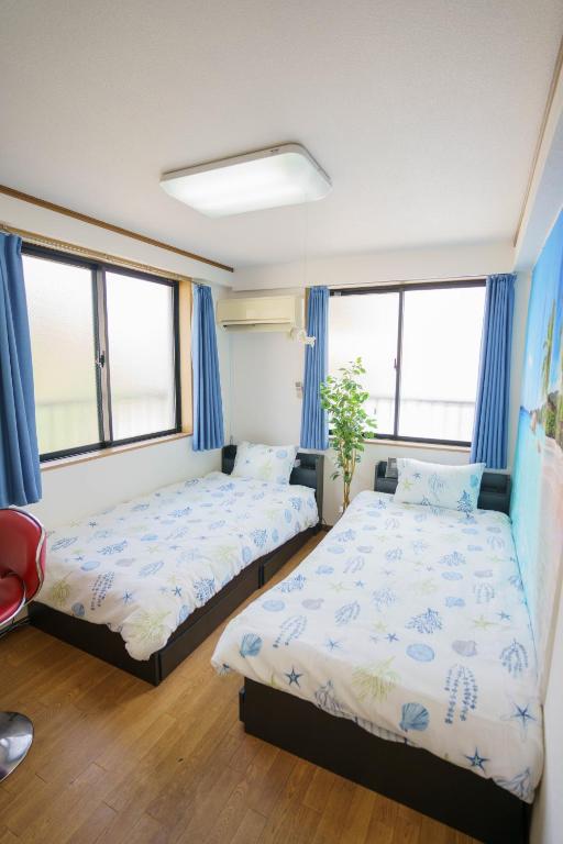 Postelja oz. postelje v sobi nastanitve BURan House