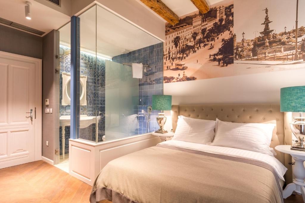 Postel nebo postele na pokoji v ubytování Procurator 7 Luxury Rooms