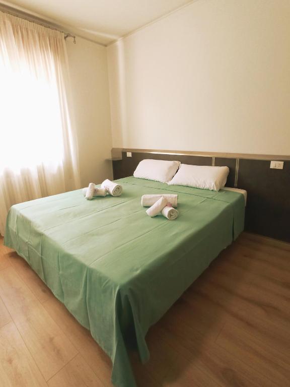 Postel nebo postele na pokoji v ubytování Affittacamere Ai Pila