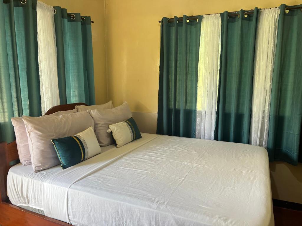 Postel nebo postele na pokoji v ubytování Gratum Beach Resort
