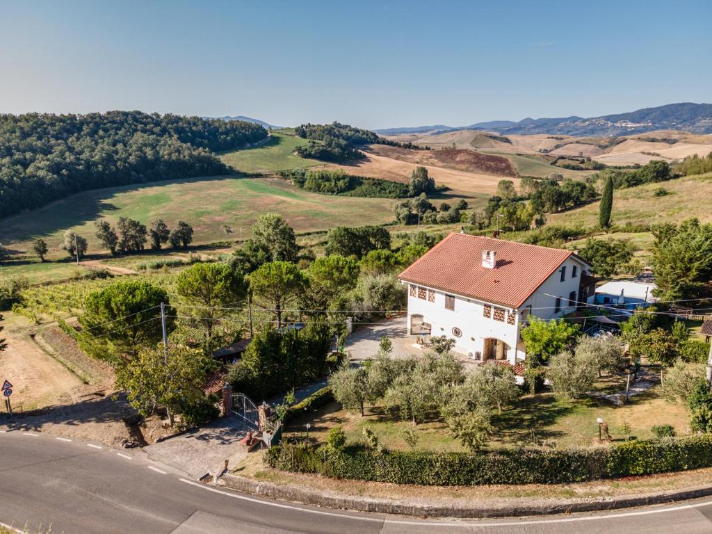 an aerial view of a house on a hill at Sole Verde green house in Terricciola