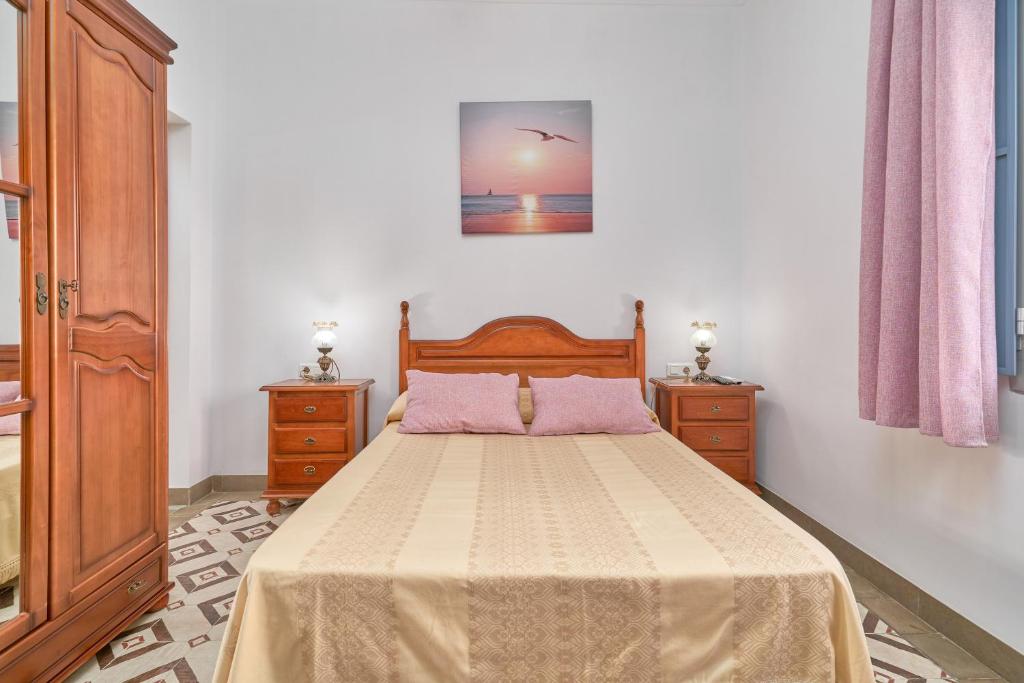 Postel nebo postele na pokoji v ubytování Casa Rafalita